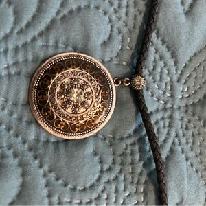 Elegant Silver and Black Pendant on Braided Leather